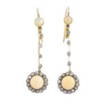 A pair of early 20th century gold opal and diamond earrings. Each designed as a circular-shape