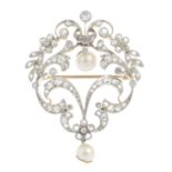 An early 20th century platinum and gold, pearl and diamond brooch. Of openwork design, the pearl,