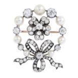 A late Victorian silver and gold, diamond and pearl brooch. Designed as an old-cut diamond pansy,