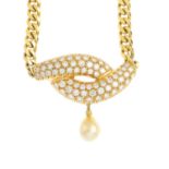 A diamond and pearl necklace. The pave-set diamond curving lines, suspending a pearl drop, to the