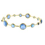 IPPOLITA - a topaz 'Lollipop' bangle. Designed as a series of circular-shape, vari-size and hue blue