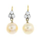 A pair of natural pearl and diamond earrings. Each designed as a pearl, suspended from an old-cut