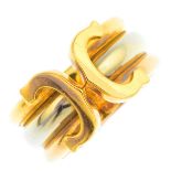CARTIER - an 18ct gold 'C de Cartier' ring. Of tri-colour design, the grooved, open band, with