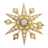 An early 20th century 18ct gold diamond and split pearl star pendant. The split pearl star, with