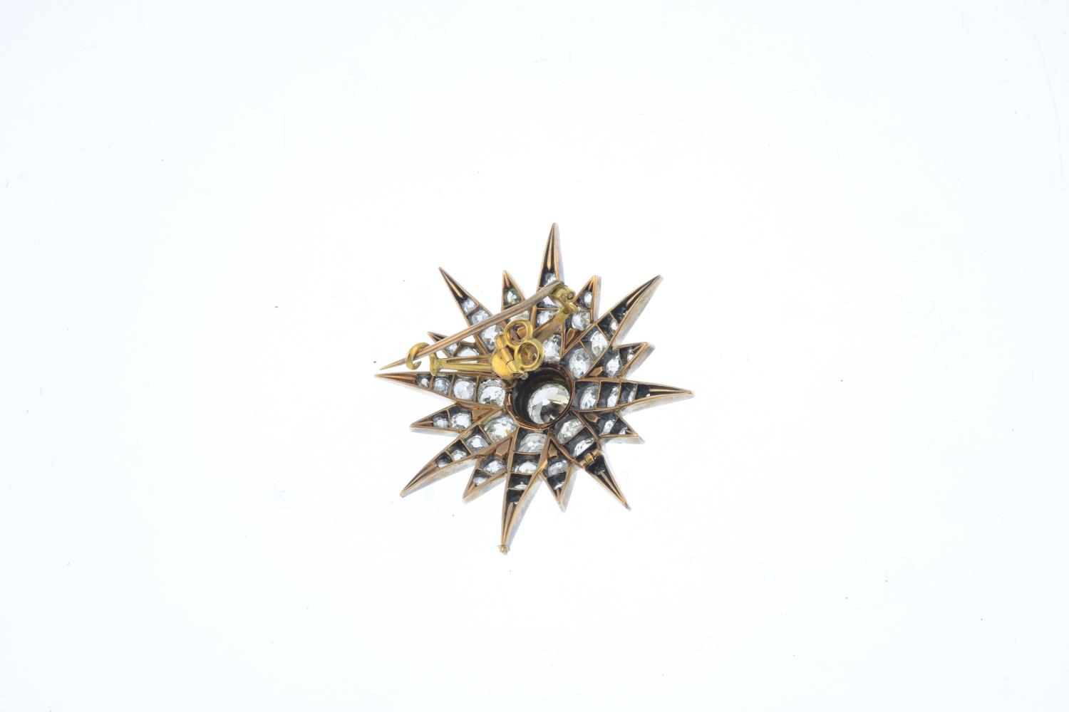 A late Victorian silver and gold diamond star brooch. The old-cut diamond, with similarly-cut - Image 2 of 2