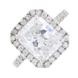 A diamond dress ring. The rectangular-shape diamond, weighing 3.01cts, with brilliant-cut diamond