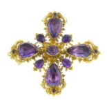 An early 19th century amethyst cross brooch. Designed as an oval-shape amethyst, with pear-shape