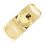 LOUIS VUITTON - a gentleman's 18ct gold 'Empreinte' band ring. Designed as a series of circular