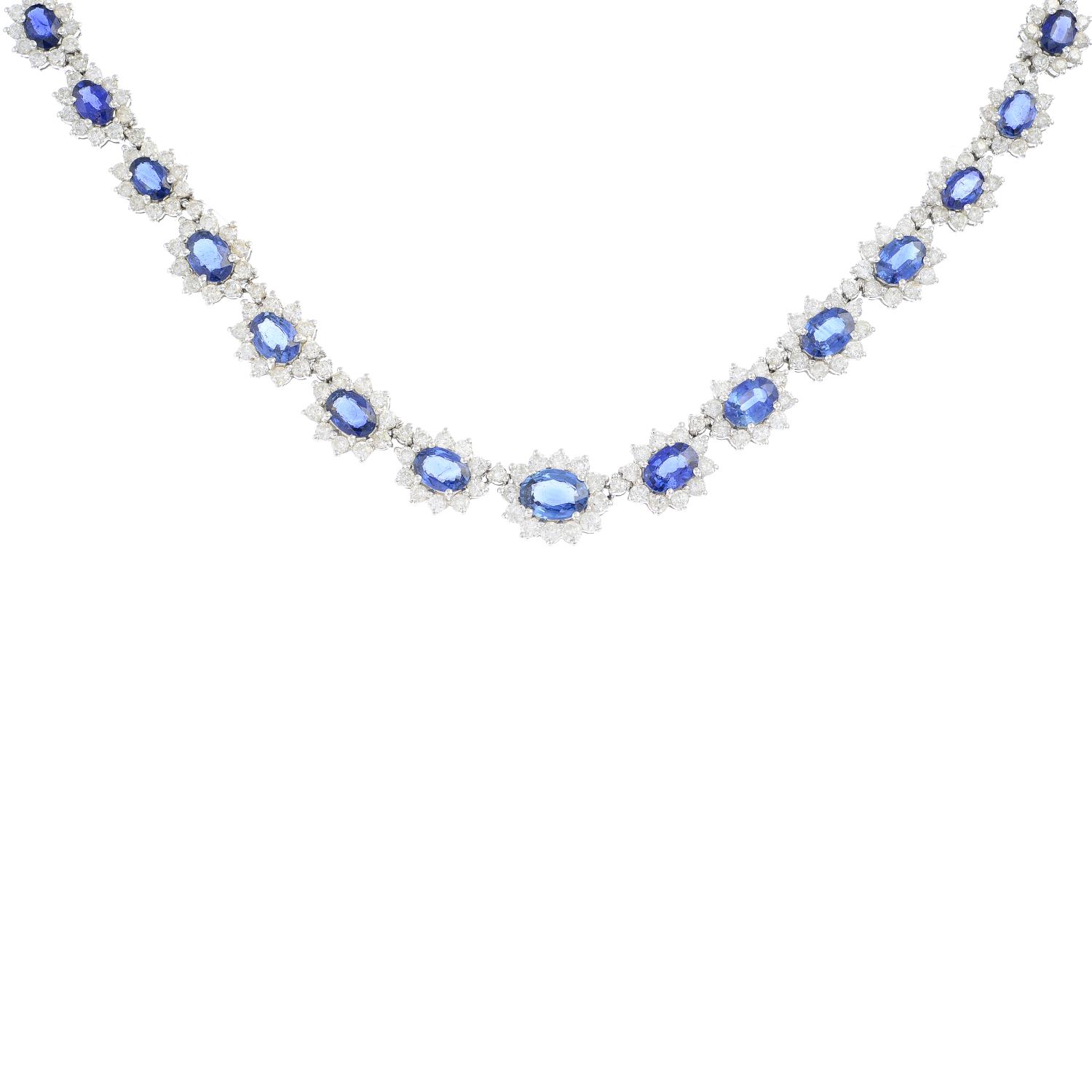 A sapphire and diamond necklace. Comprising a series of graduated oval-shape sapphire and