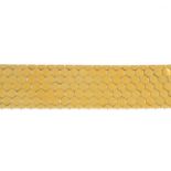 A mid 20th century bracelet. The hexagonal lattice panel, with D-shape terminals and scroll clasp.