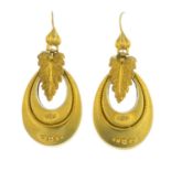 A pair of late Victorian gold earrings. Each designed as a cannetille accent tapered ovoid drop,