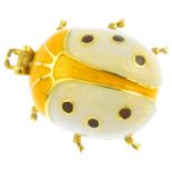 A mid 20th century 18ct gold enamel ladybird brooch. The yellow enamel ladybird, with brown-