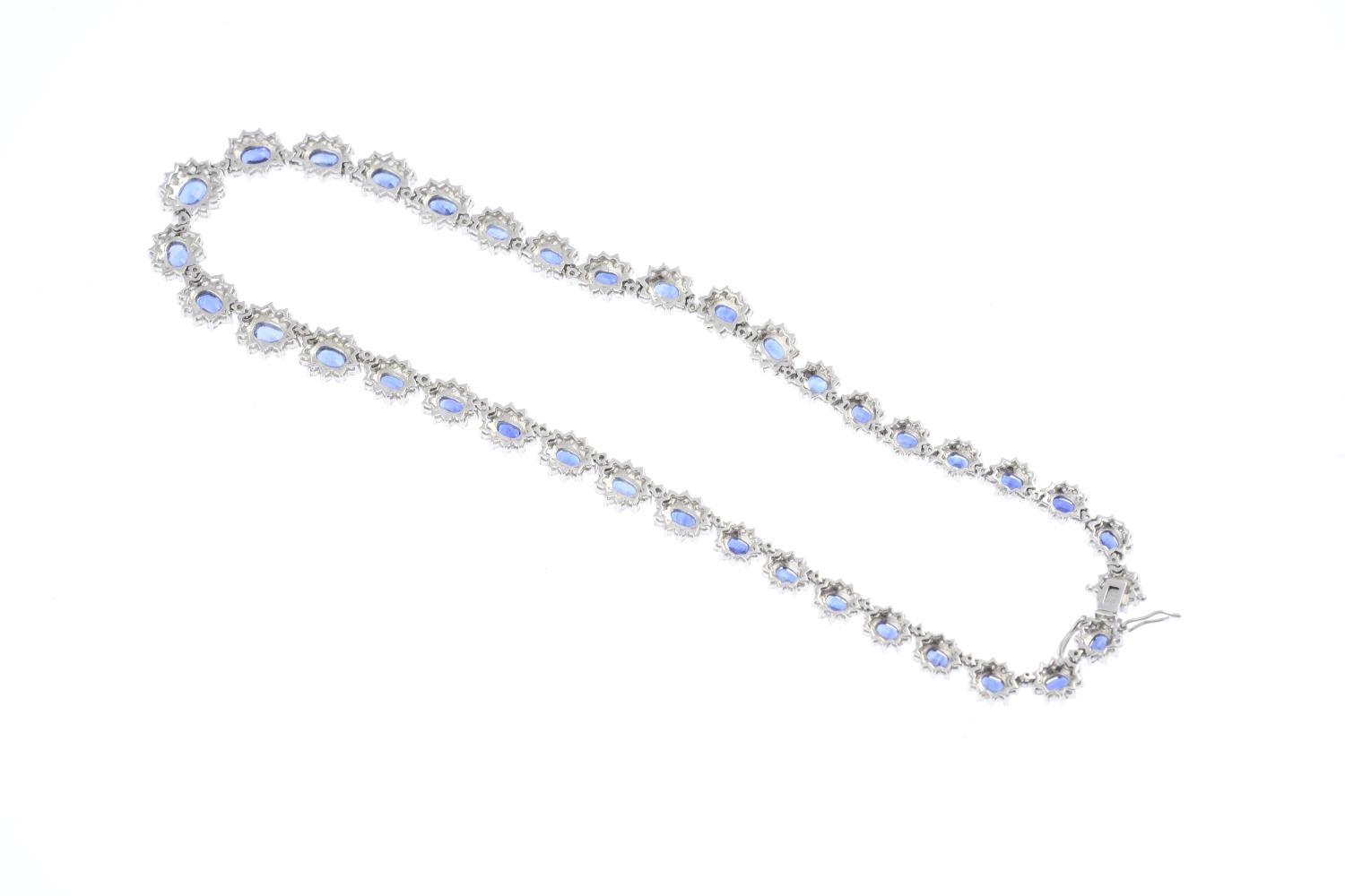 A sapphire and diamond necklace. Comprising a series of graduated oval-shape sapphire and - Image 3 of 3