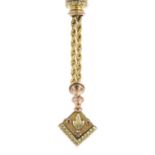 A late Victorian gold fob. Designed as a bi-colour floral and foliate motif cube, suspended from a