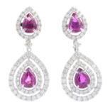 A pair of ruby and diamond earrings. Each designed as a pear-shape ruby and brilliant-cut diamond