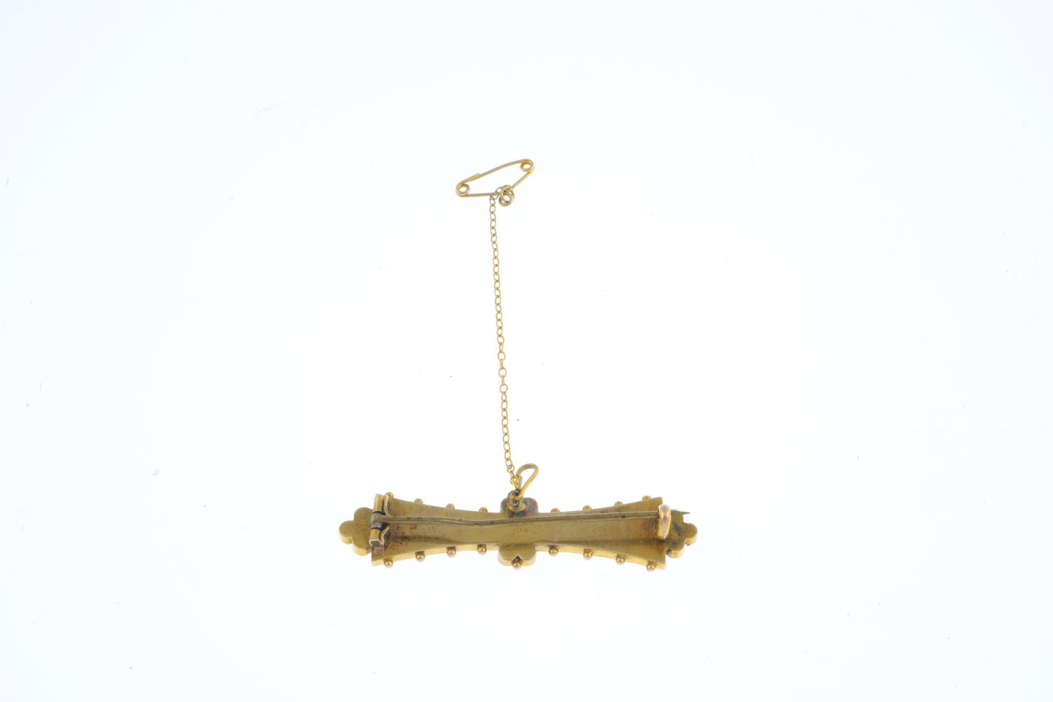 An early 20th century 15ct gold sapphire and split pearl bar brooch. The rectangular-shape pink - Image 2 of 2