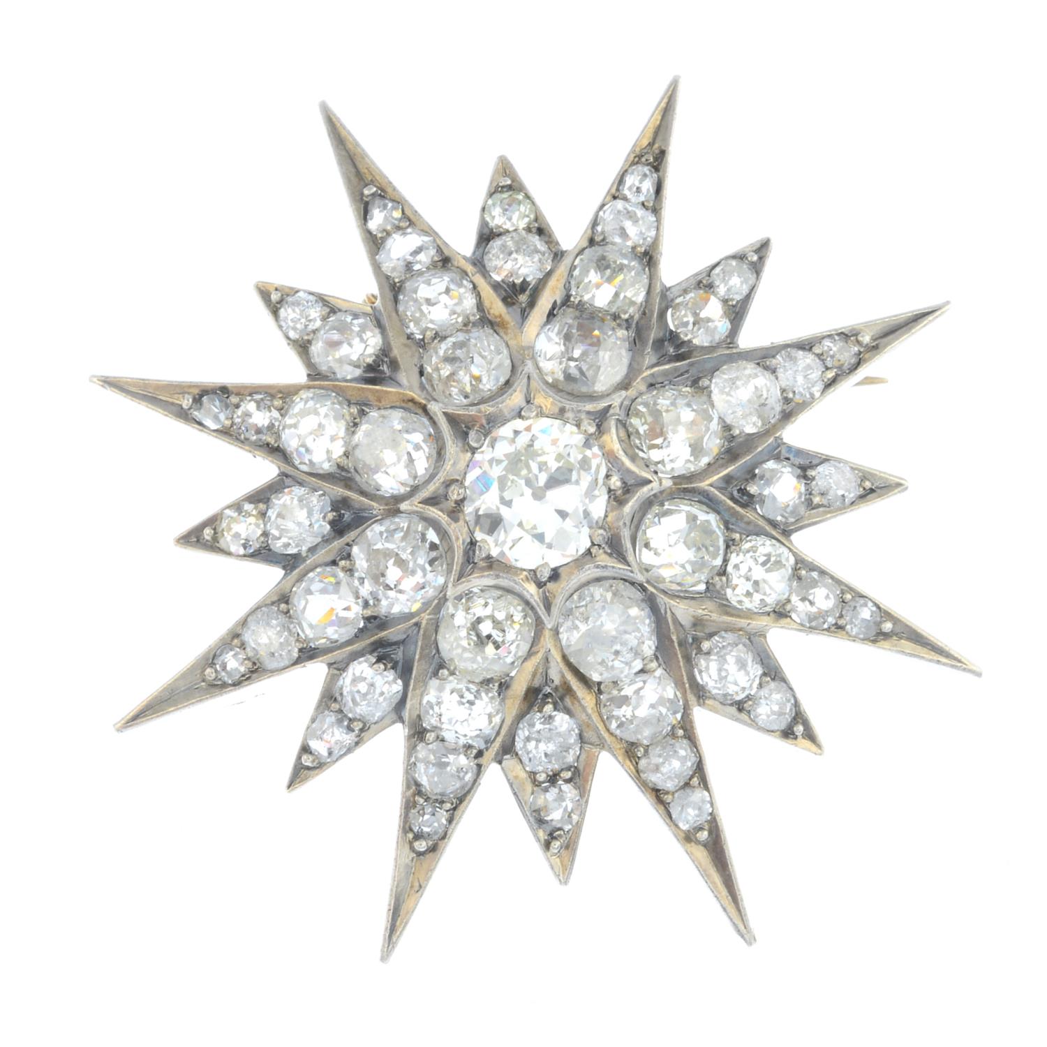 A late Victorian silver and gold diamond star brooch. The old-cut diamond, with similarly-cut