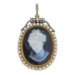 A late 19th century gold diamond and gem-set pendant. The oval onyx cameo, depicting a lady in