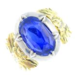 A Georgian silver and gold Sri Lankan sapphire ring. The cushion-shape sapphire collet, weighing 5.