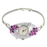 ASPREY - a lady's mid 20th century diamond and ruby cocktail watch. The circular dial with dot
