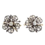 A pair of late Victorian silver and gold diamond floral brooches. Each designed as an old-cut