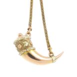 A late Victorian gold fob. Of bi-colour design, the Horn of Plenty, with floral and foliate motif,