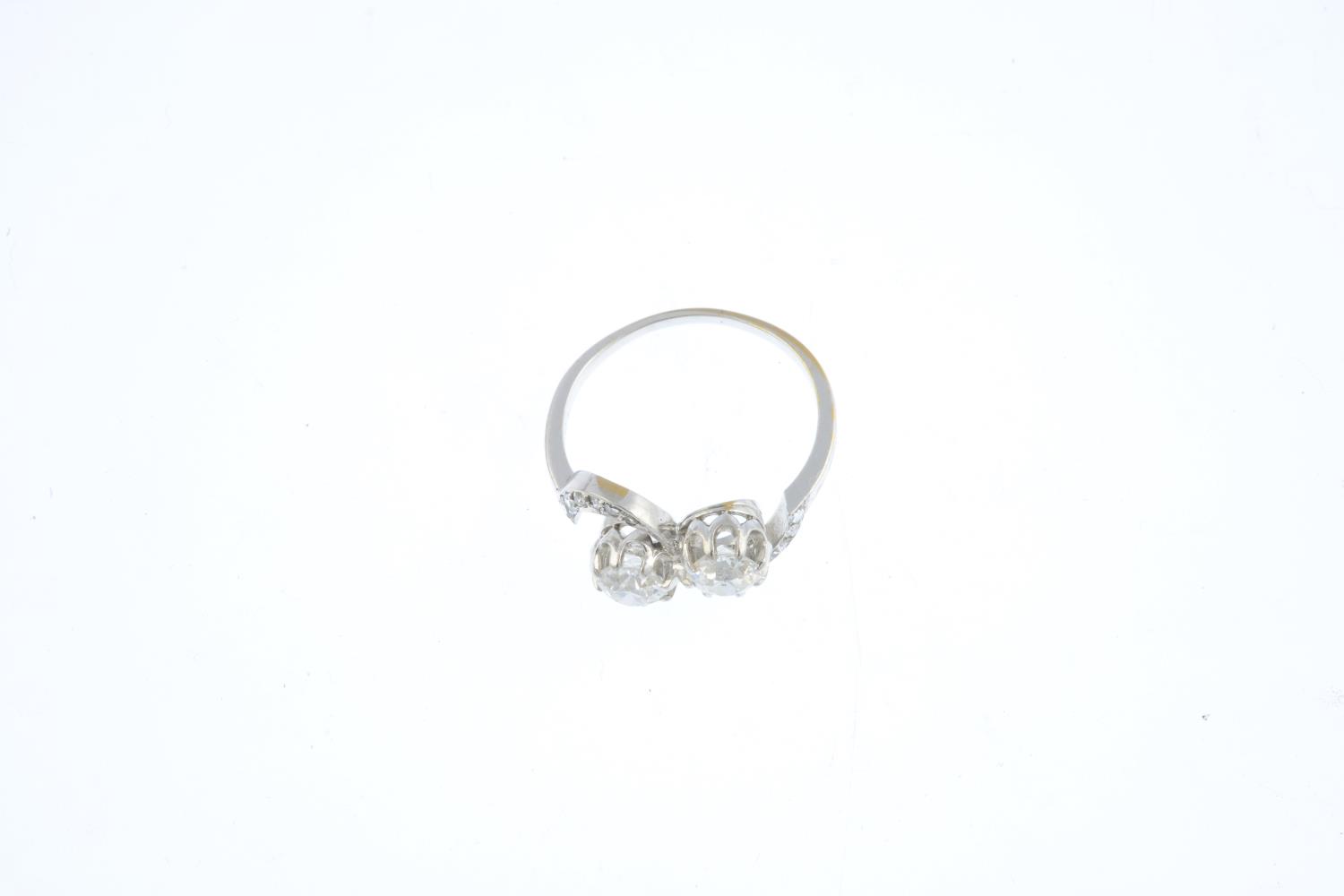 A diamond two-stone ring. Of asymmetric design, the old-cut diamonds, with rose-cut diamond - Image 3 of 3