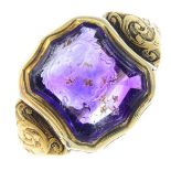 A late Victorian gold amethyst intaglio signet ring. The shield-shape amethyst carved to depict an