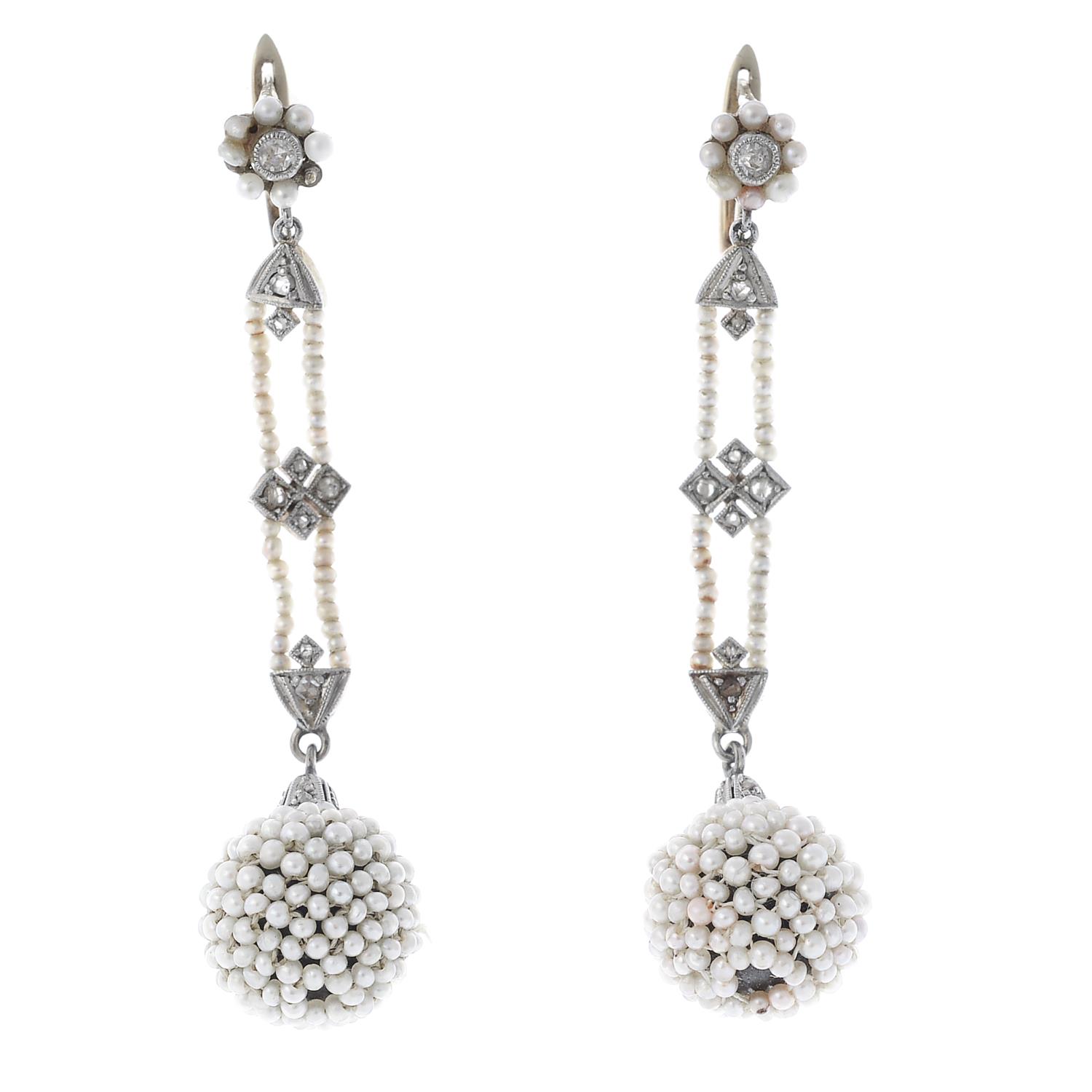 A pair of early 20th century seed pearl and diamond earrings.