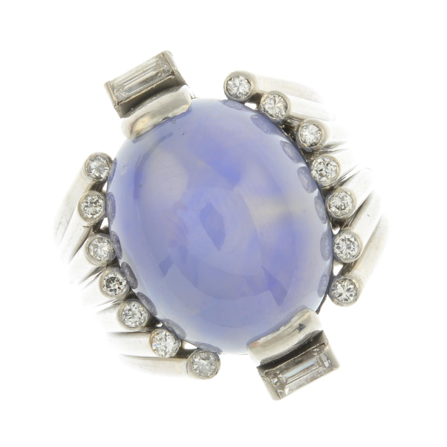 A mid 20th century 18ct gold star sapphire and diamond ring.