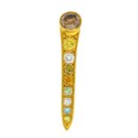 An 18ct gold coloured diamond and diamond nail brooch.