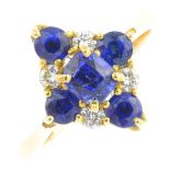 A sapphire and diamond cluster ring.