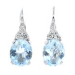 A pair of aquamarine and diamond earrings.
