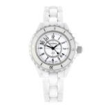 CHANEL - a lady's J12 bracelet watch. Ceramic case with calibrated bezel and stainless steel case