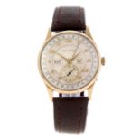 MOVADO - a gentleman's triple date wrist watch. 9ct yellow gold case, hallmarked Birmingham 1949.
