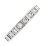 A platinum diamond half eternity ring. The brilliant-cut diamond line, inset to the plain band, with