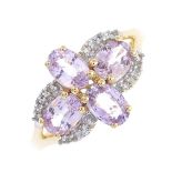 A 9ct gold sapphire ring. The oval-shape pink sapphire quatrefoil, with circular-shape white