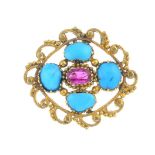 A turquoise and ruby brooch. Of openwork design, the oval-shape ruby, with oval turquoise cabochon