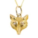 A diamond pendant. Designed as a textured fox head, with old-cut diamond eyes, suspended from a