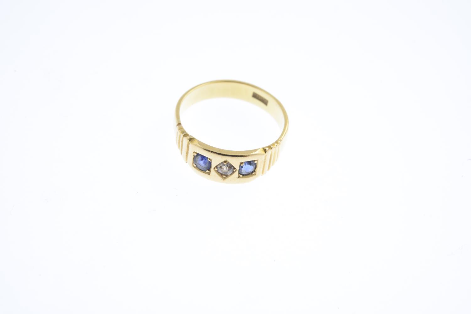 A sapphire and diamond three-stone ring. Designed as an old-cut diamond, with oval-shape sapphire - Image 3 of 3