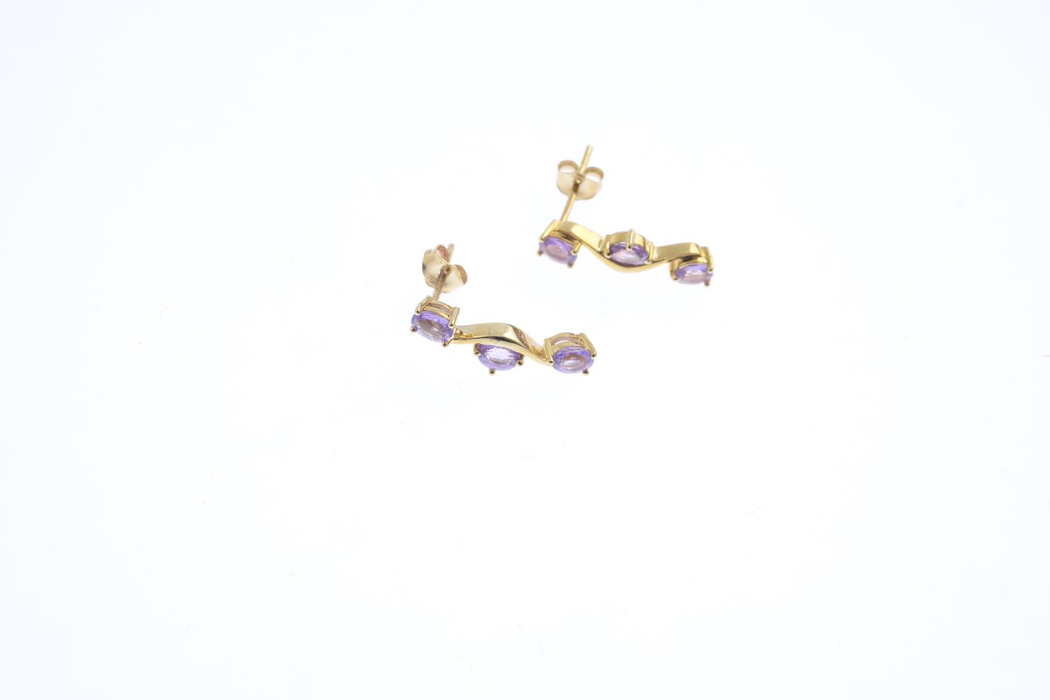 Four 9ct gold gem-set rings and a pair of earrings. To include an amethyst and diamond dress ring, - Image 2 of 3