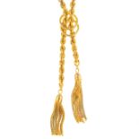 A 1980s 9ct gold rope twist necklace. Designed as two tassels, suspended from a rope-twist chain,