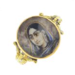 An 18ct gold portrait ring. The circular-shape portrait, depicting Mumtaz Mahal, with clear