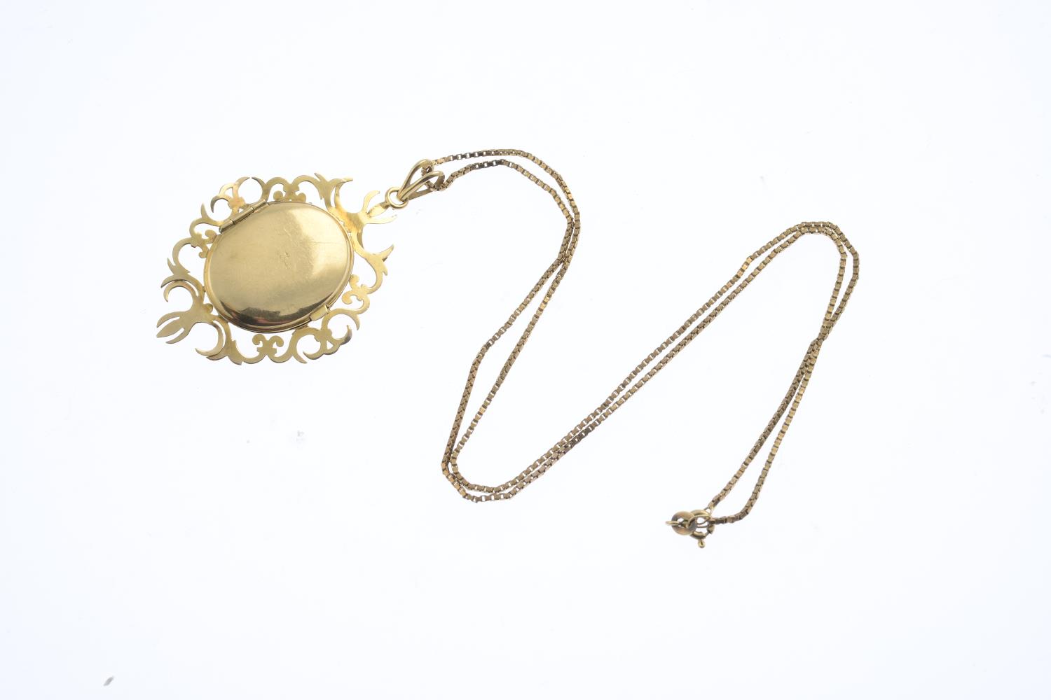 A 9ct gold garnet and split pearl locket pendant. The oval garnet cabochon and split pearl - Image 2 of 2