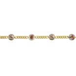 A reverse-carved intaglio bracelet. Designed as a series of reverse carved rock crystal cabochons,