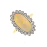 An opal and diamond cluster ring. The oval opal cabochon, within a single-cut diamond scalloped