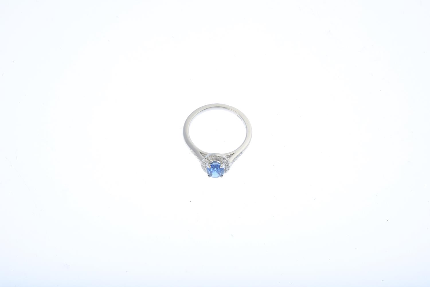 An 18ct gold sapphire and diamond cluster ring. The oval-shape sapphire, within a brilliant-cut - Image 3 of 3