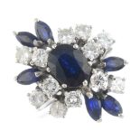 A 1970s sapphire and diamond dress ring. The oval-shape sapphire, with brilliant-cut diamond and