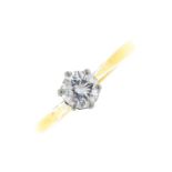 An 18ct gold diamond single-stone ring. The brilliant-cut diamond, with tapered shoulders. Estimated