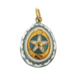 An enamel egg charm. Of pear-shape outline, the white enamel star, atop alternating green enamel and